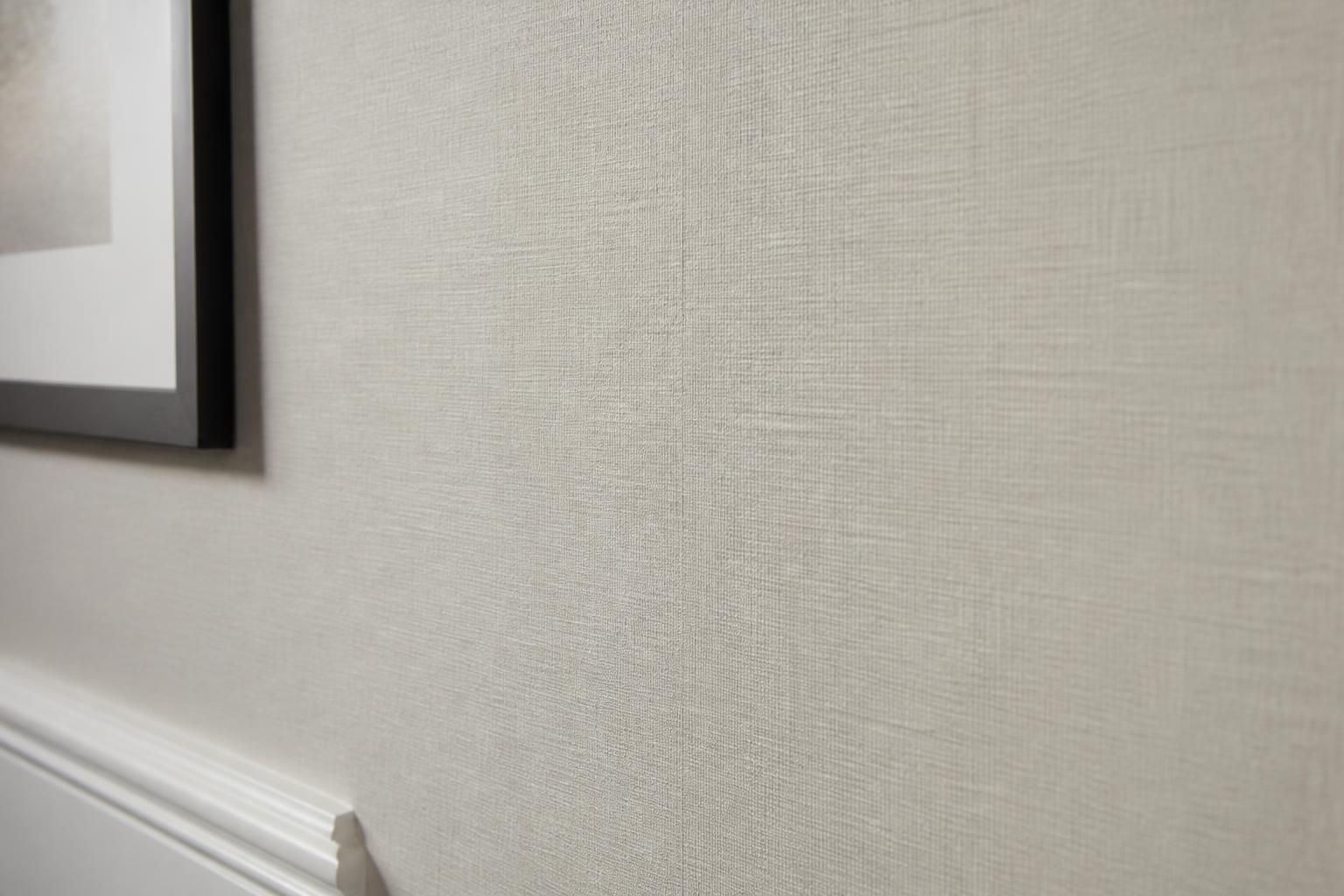 Repaired wallpaper seam blending into a finished wall